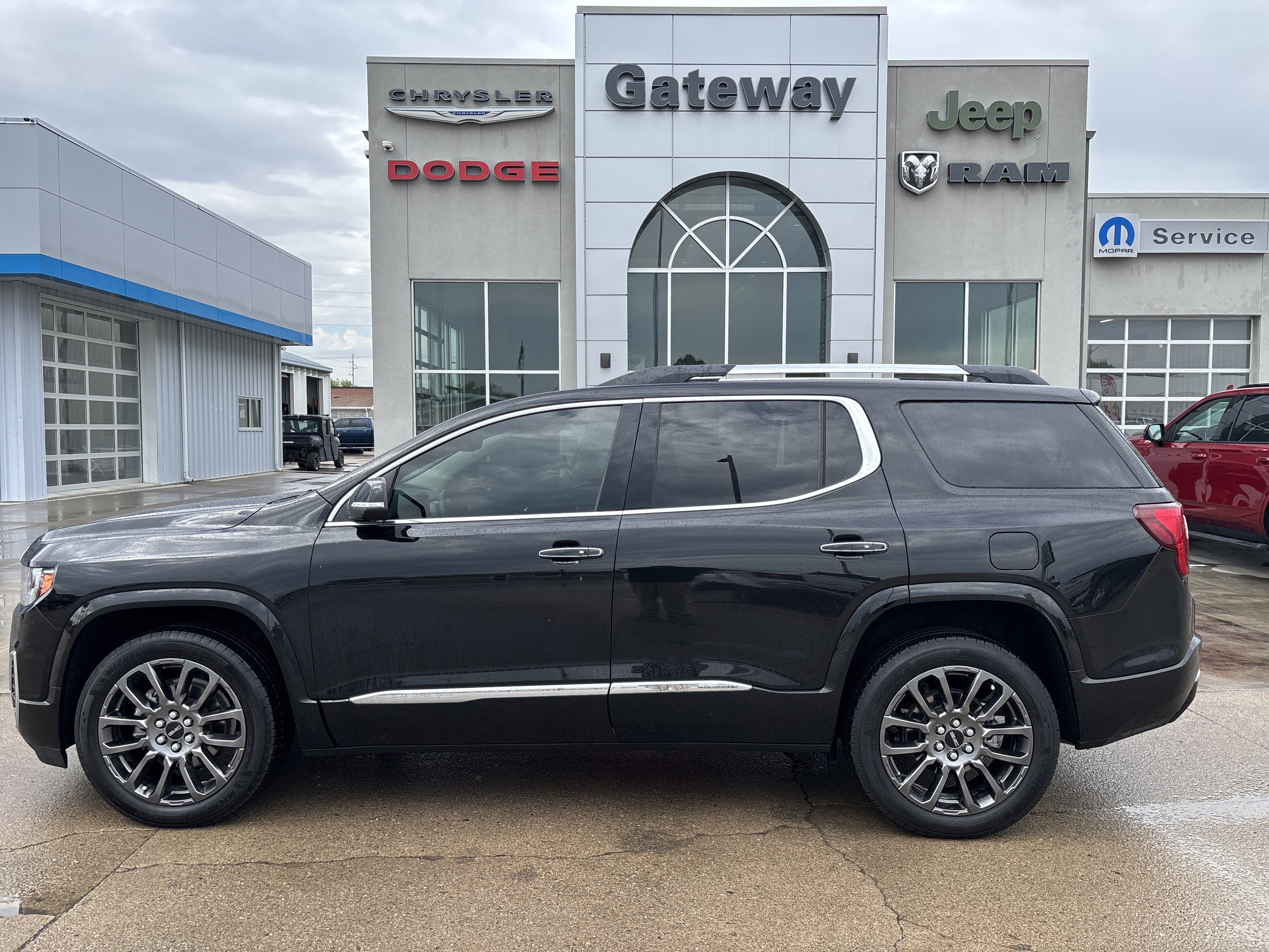 2023 GMC Acadia AWD Denali in Ebony Twilight Metallic — front three-quarter view
