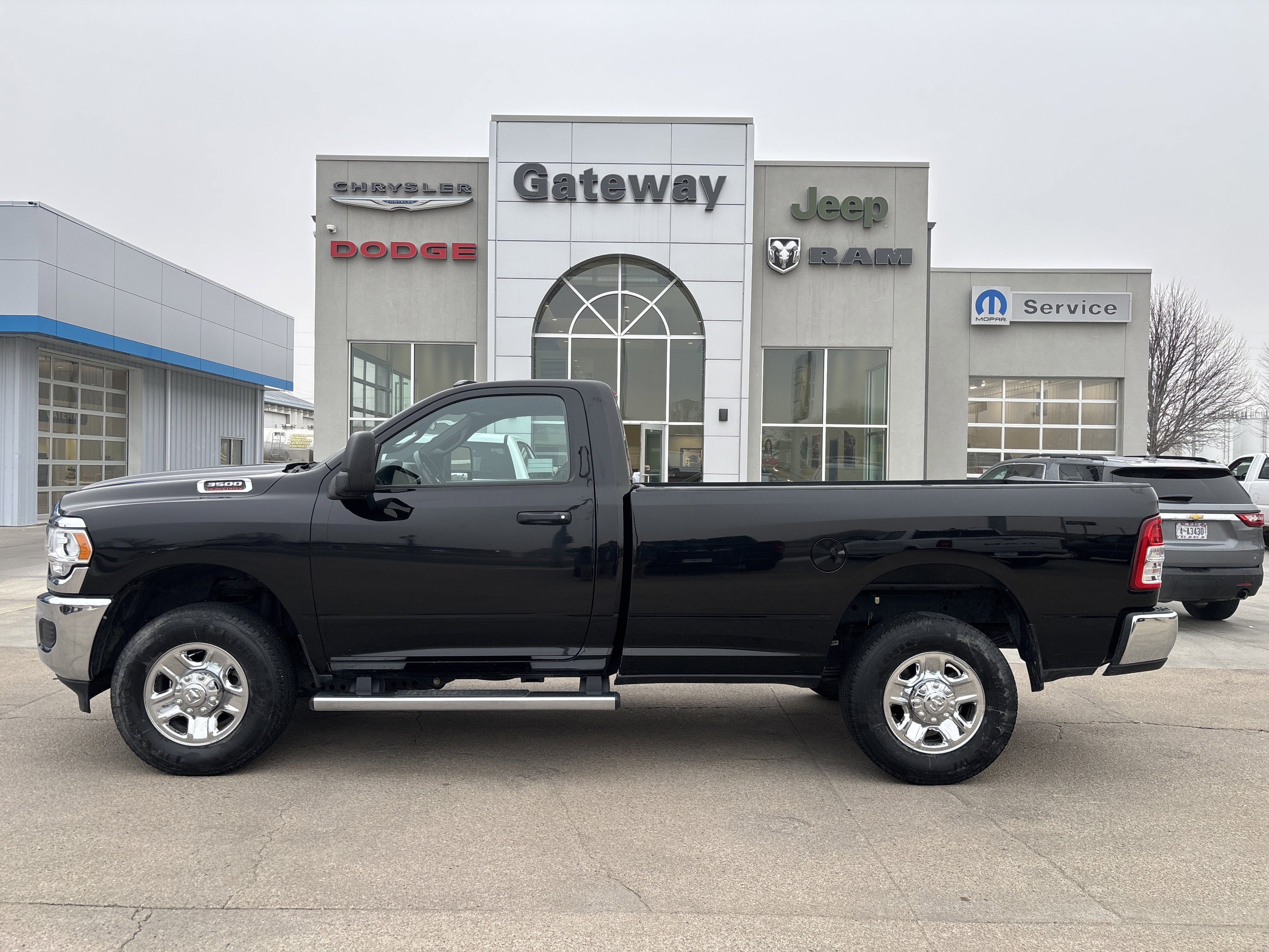 2024 RAM 3500 Tradesman Regular Cab 4x4 8' Box in Diamond Black Crystal Pearlcoat — front three-quarter view